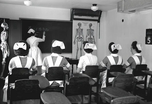 a black and white photo of a classroom