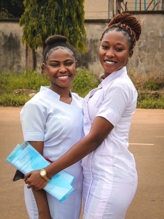 a couple of women standing next to each other